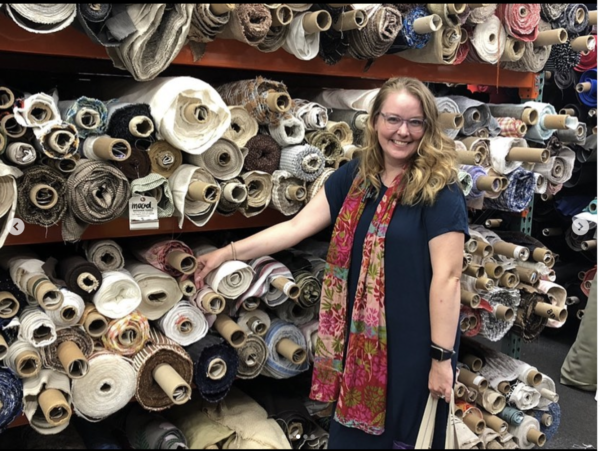 Trish standing in Mood fabrics in September 2019.